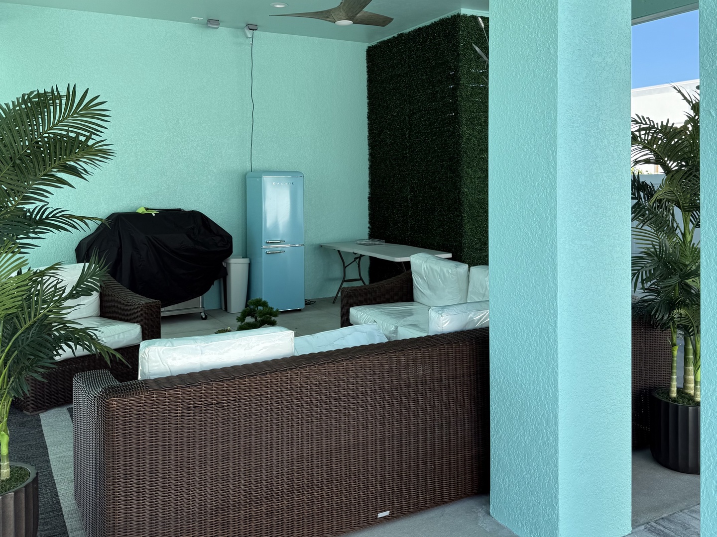 Relax in your private tropical terrace with comfortable wicker seating, lush palms creating a serene oasis for morning coffee or evening wind-downs.