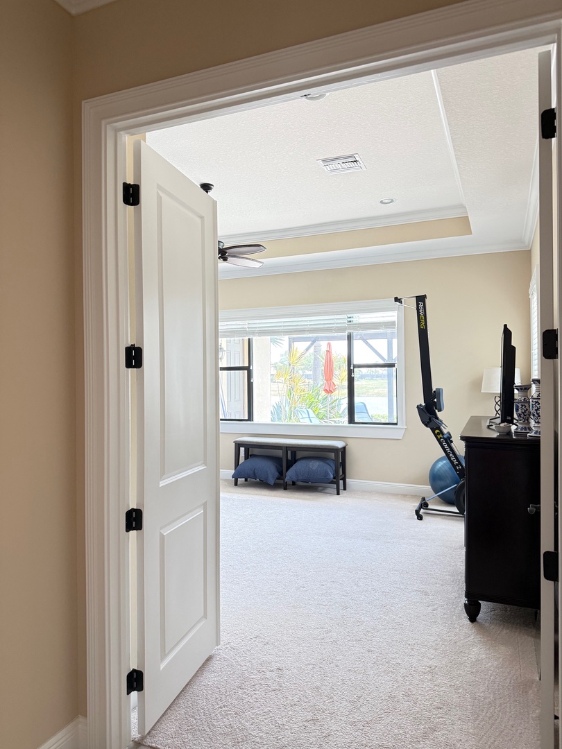 Your bright, modern bedroom features a flat-screen TV and cozy seating area, creating the perfect space to relax after exploring.