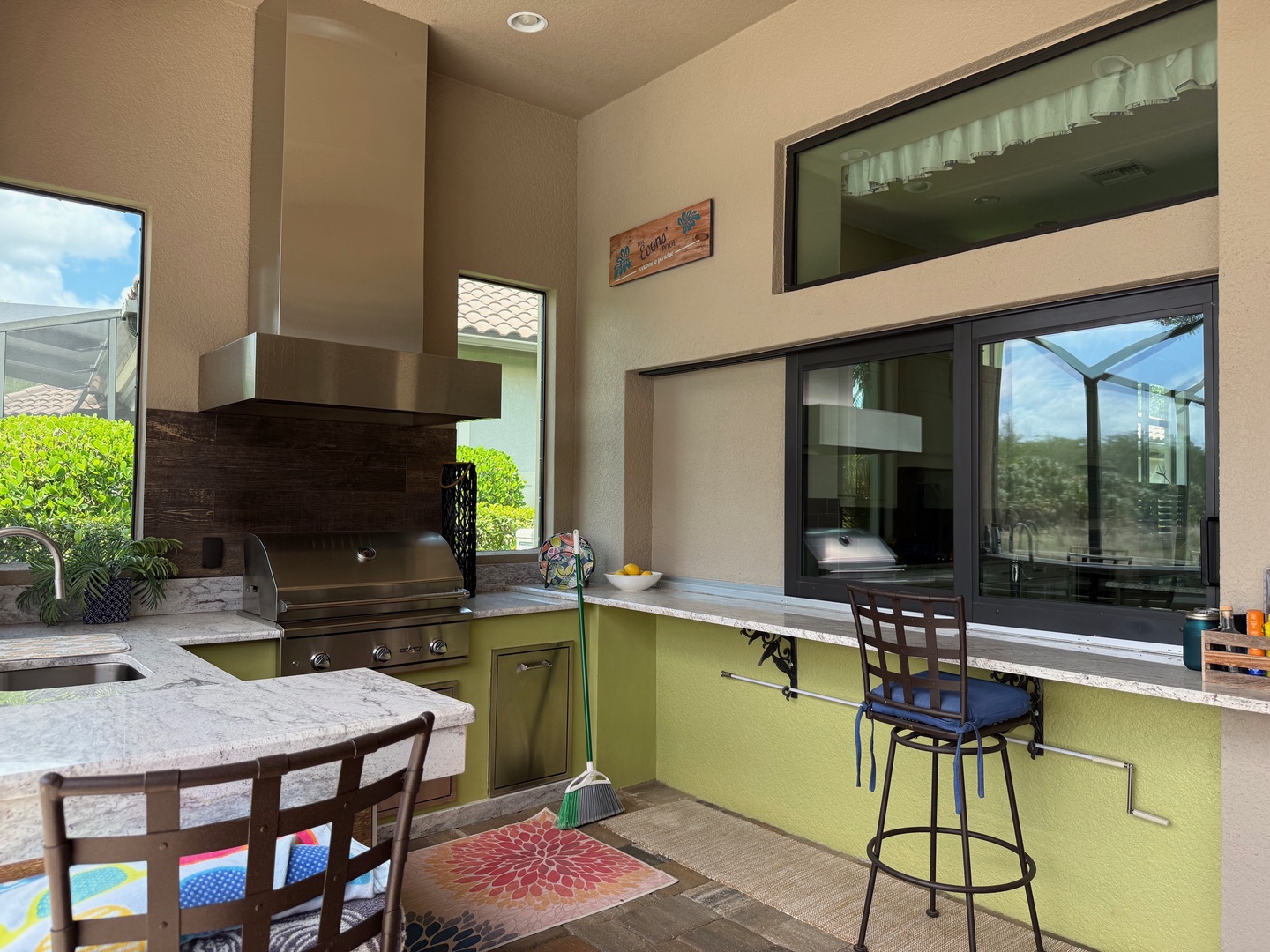 Grill your favorite meals in this well-equipped outdoor kitchen, complete with granite counters and modern appliances.