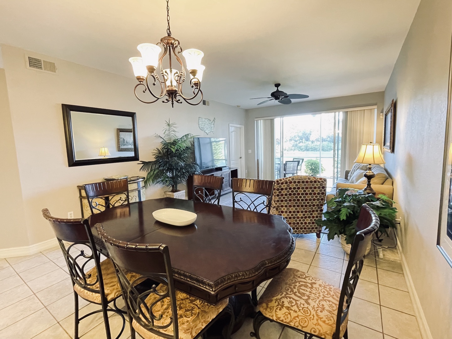 Gather around your elegant dining table for memorable meals, with a beautiful chandelier casting warm light over conversations.