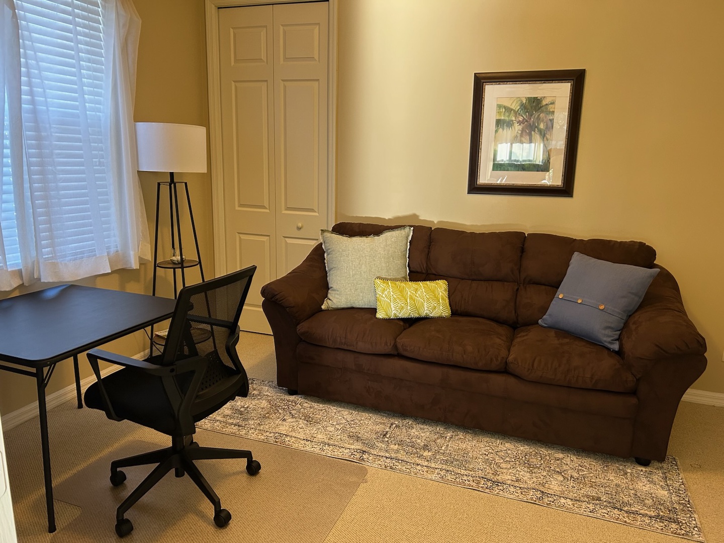 Relax on your comfortable sofa or catch up on work at the desk - this inviting space offers flexibility for both rest and productivity.