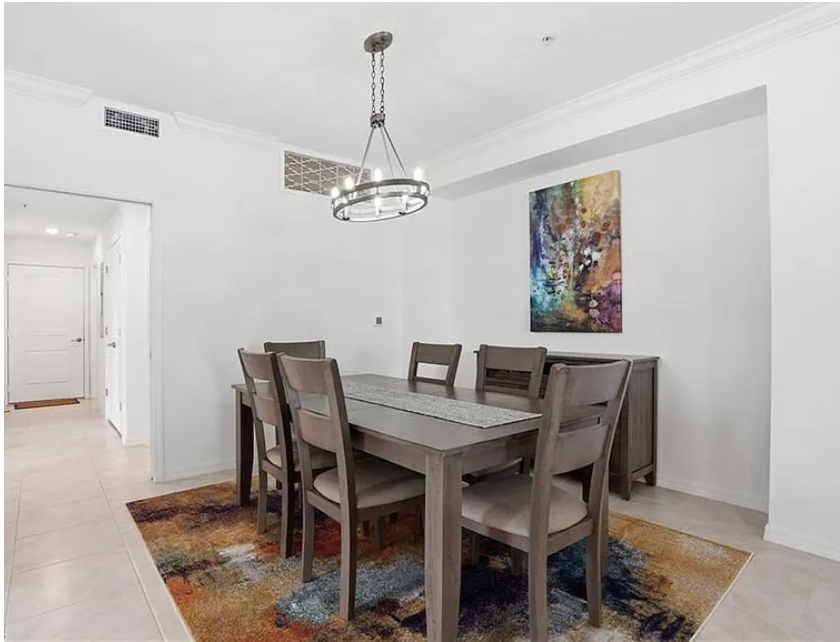 Gather around your private dining table under elegant modern lighting—perfect for savoring morning coffee or evening meals together.