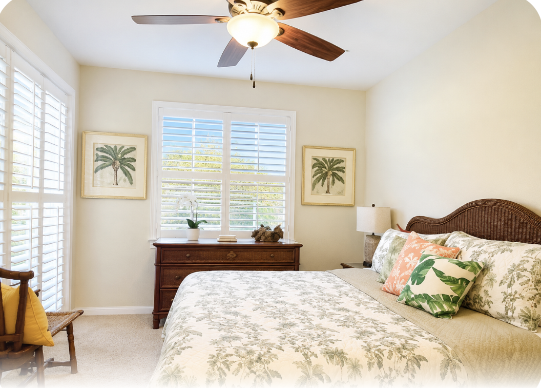 Unwind in your peaceful bedroom with a plush king bed, tropical accents, and a ceiling fan to keep you cool. Natural light fills the room, creating a serene retreat after your day of exploration.