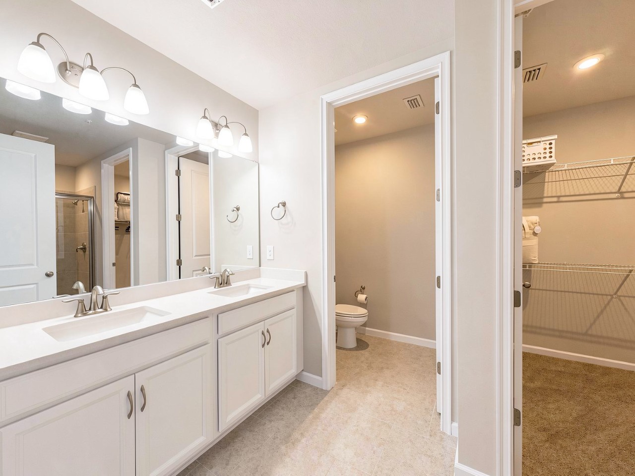 Freshen up in your spacious en-suite bath with dual vanities, soft lighting, and plenty of storage—everything you need to start and end your day feeling relaxed.