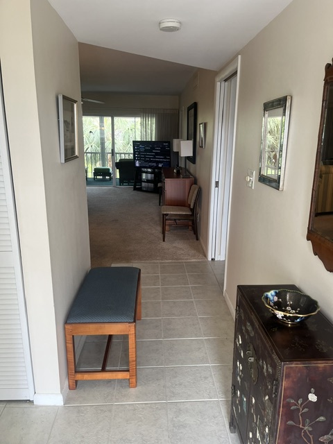 A welcoming hallway draws you into your home away from home, where natural light and comfortable spaces await your arrival.
