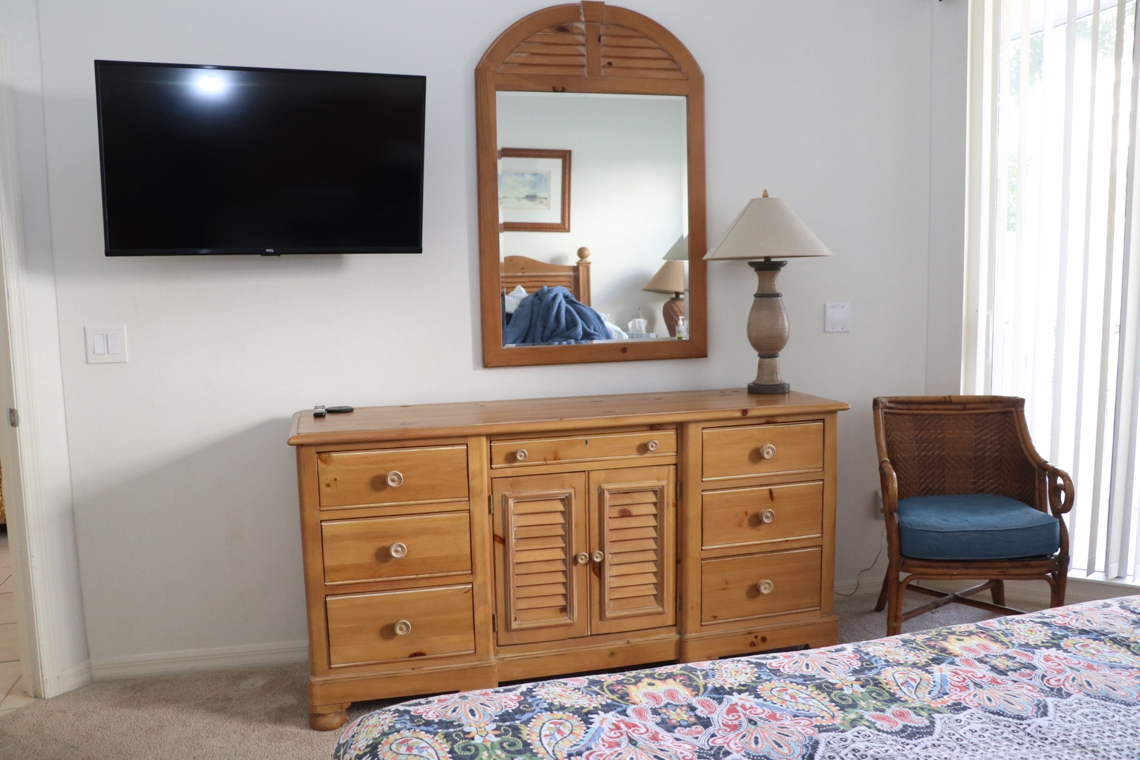 Unwind in your peaceful retreat with coastal charm, featuring warm wood furnishings, entertainment amenities, and comfortable seating perfect for relaxation.