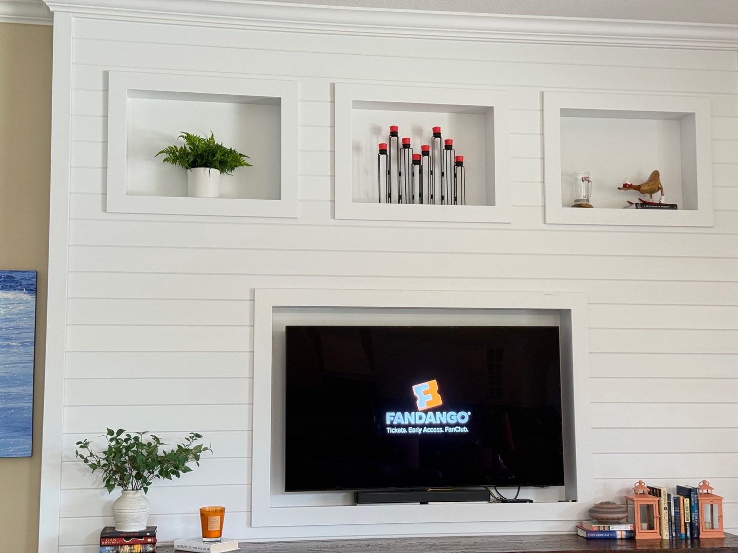 Cozy up in your living space with a smart TV ready for movie nights and built-in shelves for your favorite books.