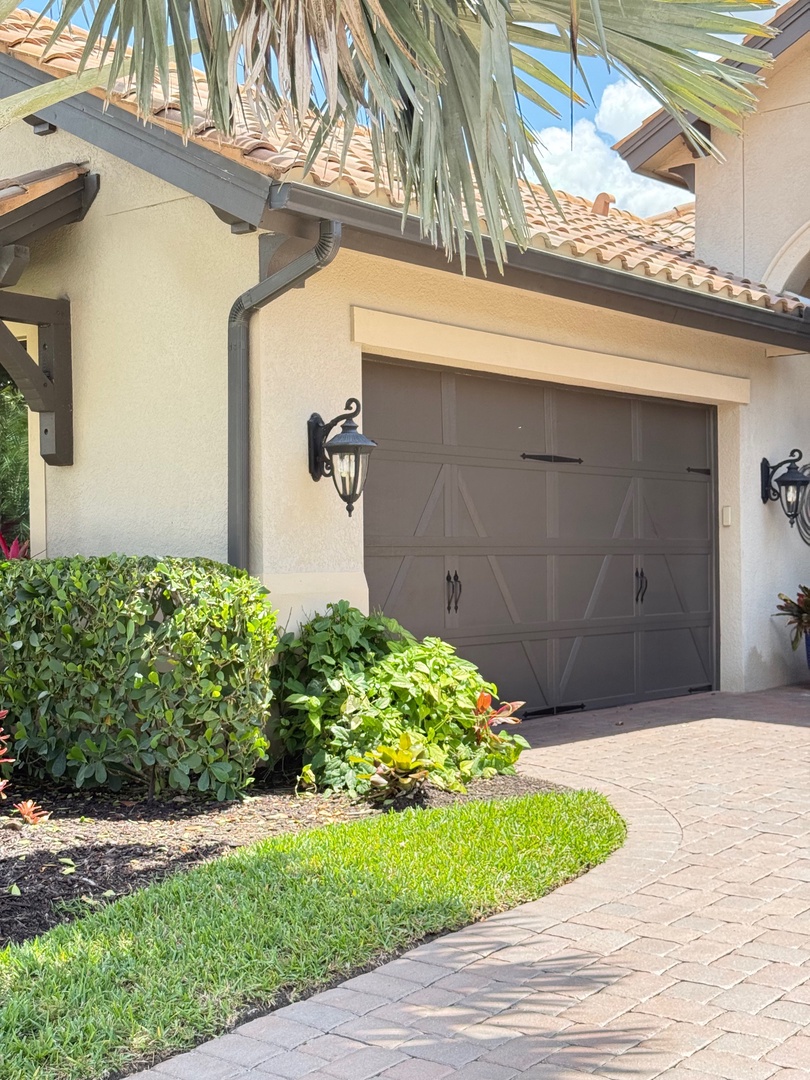 Three car garage Your covered entrance features elegant stonework and lush landscaping that welcomes you home after busy days exploring.
