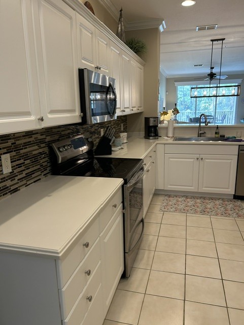 Whip up your favorite meals in this bright, spacious kitchen with sleek granite counters and modern stainless appliances. Plenty of cabinetry keeps everything organized while soft natural light flows in.