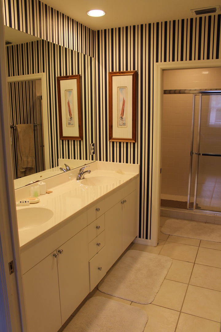 Your private bathroom features a sleek vessel sink and modern fixtures, creating a spa-like retreat for your stay.
