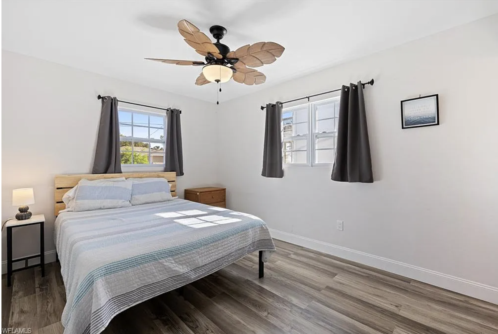 Your peaceful retreat awaits with crisp linens, gentle natural light, and a soothing ceiling fan to keep you comfortable after a day of adventure.