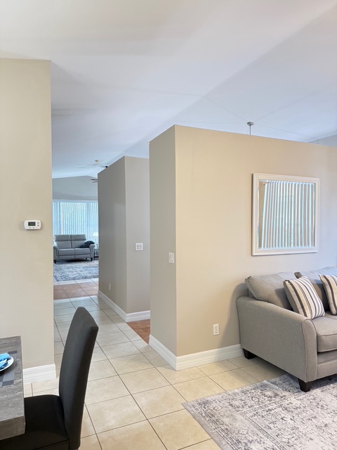 Relax in your spacious living area with comfortable seating and modern design that flows seamlessly through to the kitchen and main living area.