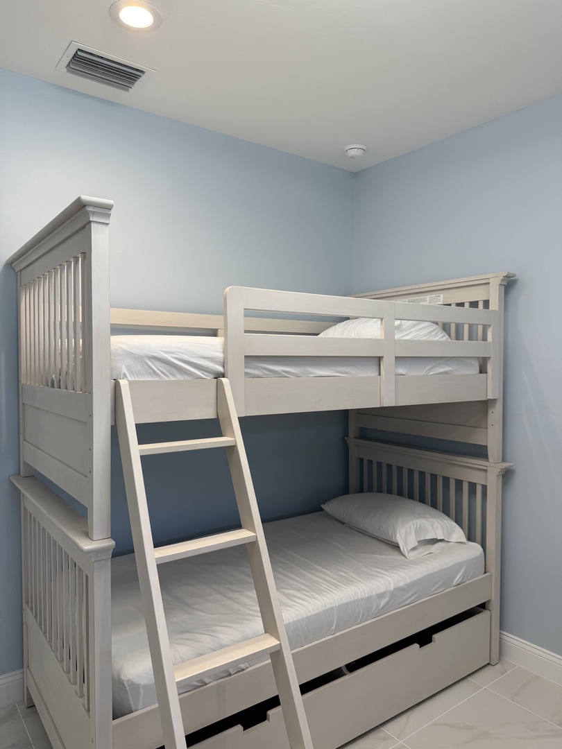 Your cozy bunk bed room features crisp white linens and modern design, perfect for comfortable group stays or family adventures.