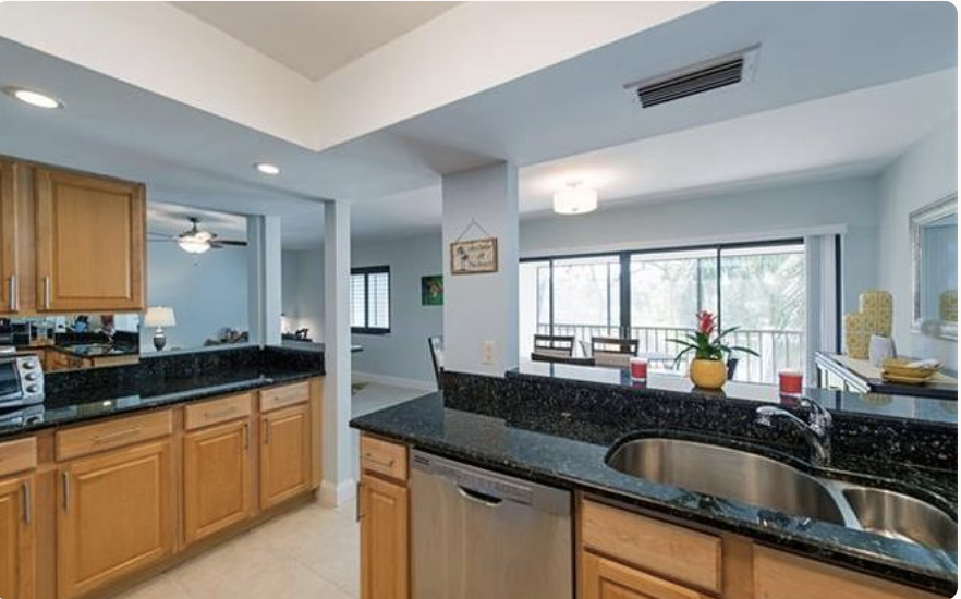 Your modern kitchen offers sleek granite countertops, stainless steel appliances, and plenty of space to prepare meals while enjoying natural light streaming through large windows.