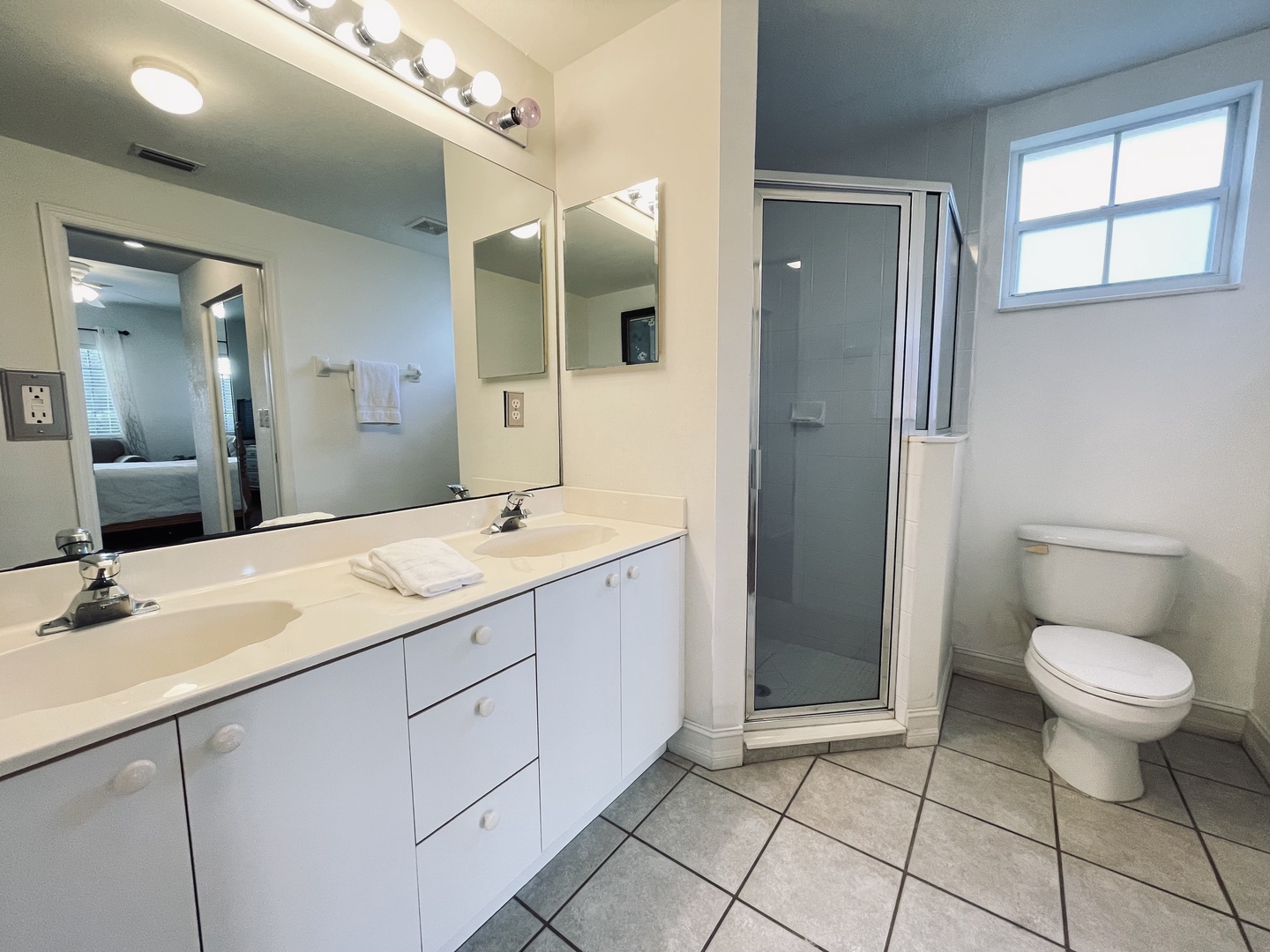 Main bedroom with private walk in shower double sinks