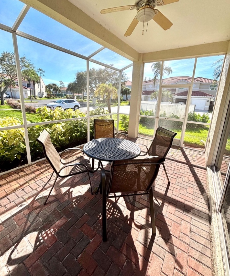 Your screened porch offers the perfect spot to enjoy morning coffee or evening meals, with views of the peaceful neighborhood.