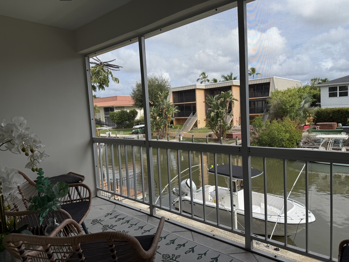 Your screened porch offers tranquil canal views with your private boat dock just steps away.