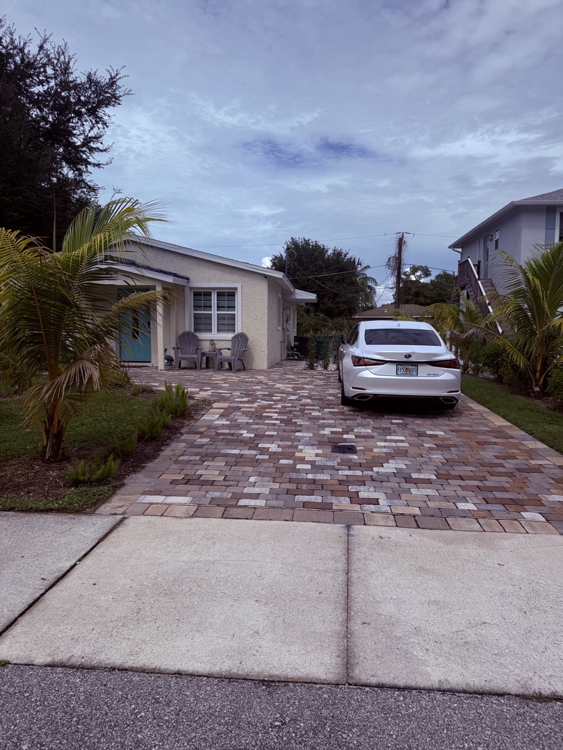 This cheerfully landscaped property features a private pool and tropical greenery, with convenient parking right at your doorstep, set in a peaceful residential neighborhood.