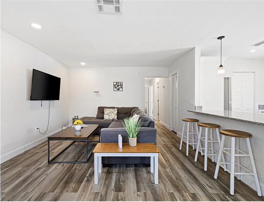 Settle into your bright, open living space where a comfortable sectional awaits movie nights and morning coffee at the breakfast bar.