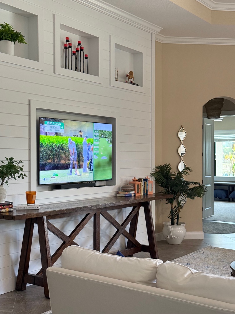 Unwind in your bright living space with modern TV, cozy seating, and thoughtful touches that make this feel like home.