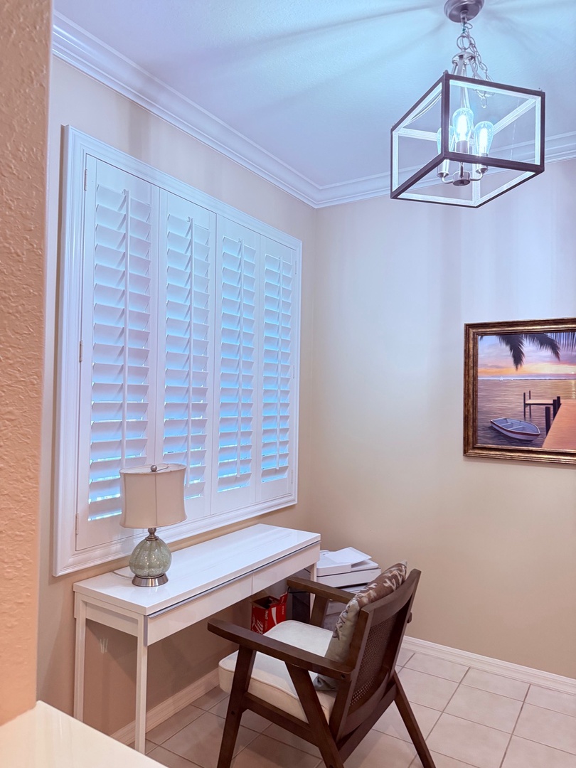 Your private bedroom features a comfortable queen bed, stylish lighting, and plenty of natural light streaming through the shutters for a peaceful night's rest.