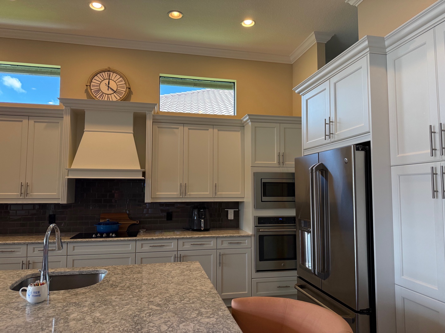 Create culinary magic in your spacious gourmet kitchen with granite countertops, stainless steel appliances, and ample storage.