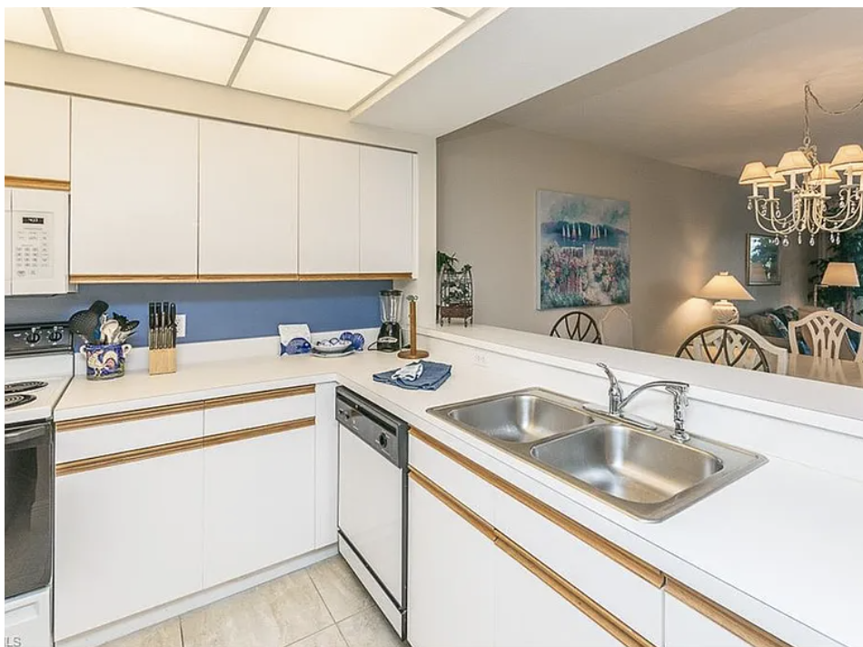This bright, open kitchen gives you everything you need to prepare your favorite meals, with a skylight that fills the space with natural light and a seamless view into the dining area.