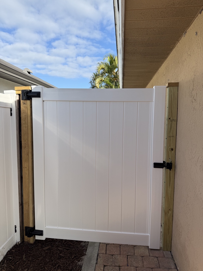 Step into your private outdoor retreat with a sheltered patio space and glimpses of blue sky overhead.