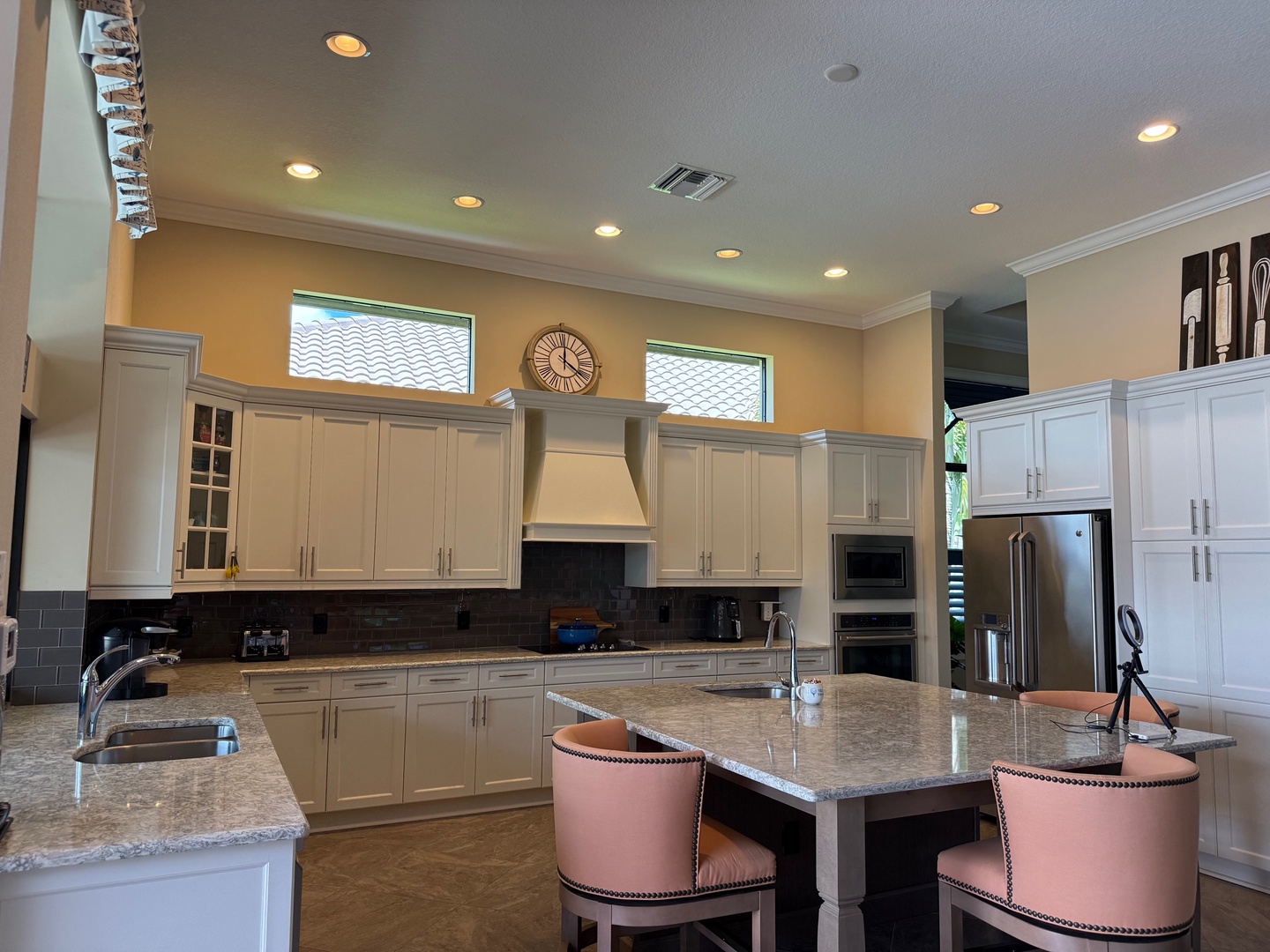 Cook memorable meals in your gourmet kitchen featuring granite countertops, premium appliances, and stylish bar seating.