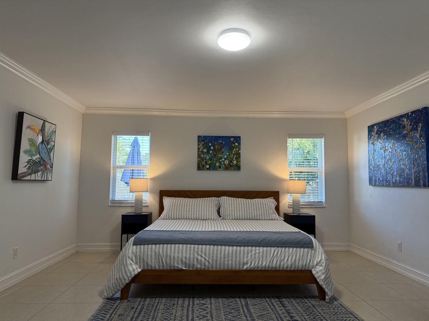 Sink into King crisp linens and enjoy peaceful garden views through your dual windows, with warm bedside lighting creating the perfect reading atmosphere.