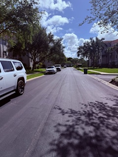 A quiet suburban street near the property, lined with trees and homes, offering a peaceful residential setting for your stay.