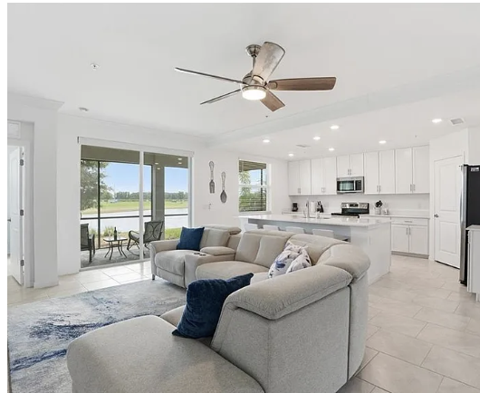 Sink into the plush sectional and take in the open-concept flow of your home away from home, where the kitchen, living area, and patio invite easy togetherness.