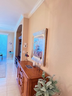 Step inside and feel right at home in this bright, welcoming hallway. The airy space flows seamlessly from room to room, inviting you to relax and settle in.
