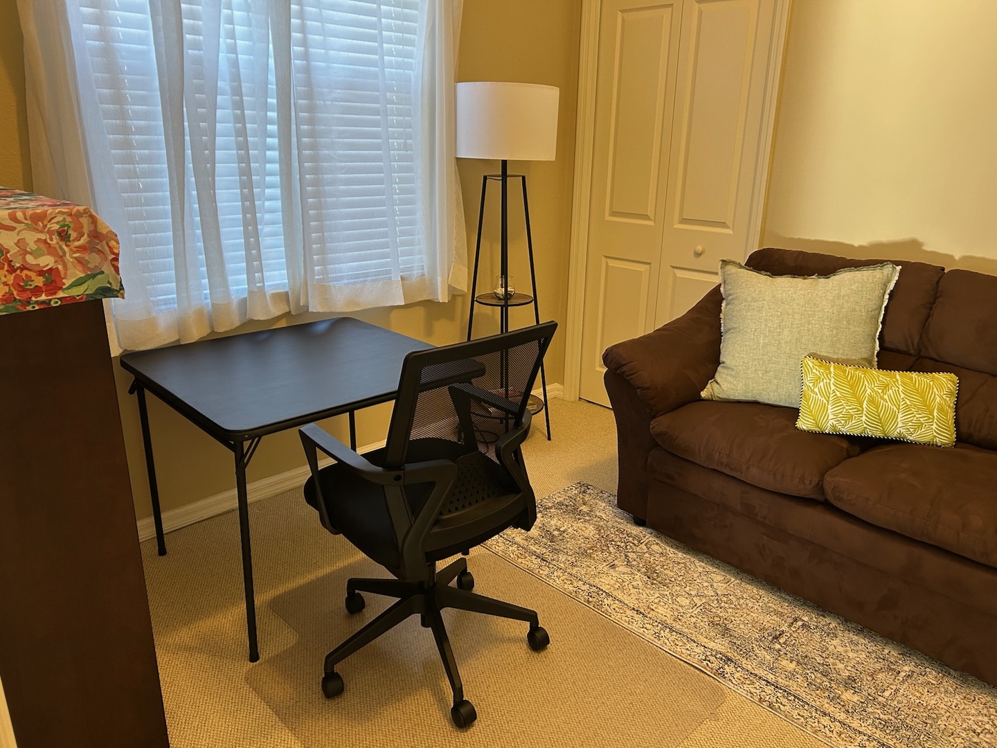 Your comfortable workspace combines productivity and relaxation with a dedicated desk, ergonomic chair, and cozy seating area for both focused work and unwinding.