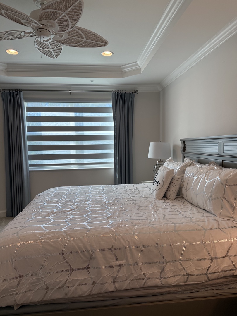 Sink into crisp white linens and drift off as natural light filters through your bedroom window.