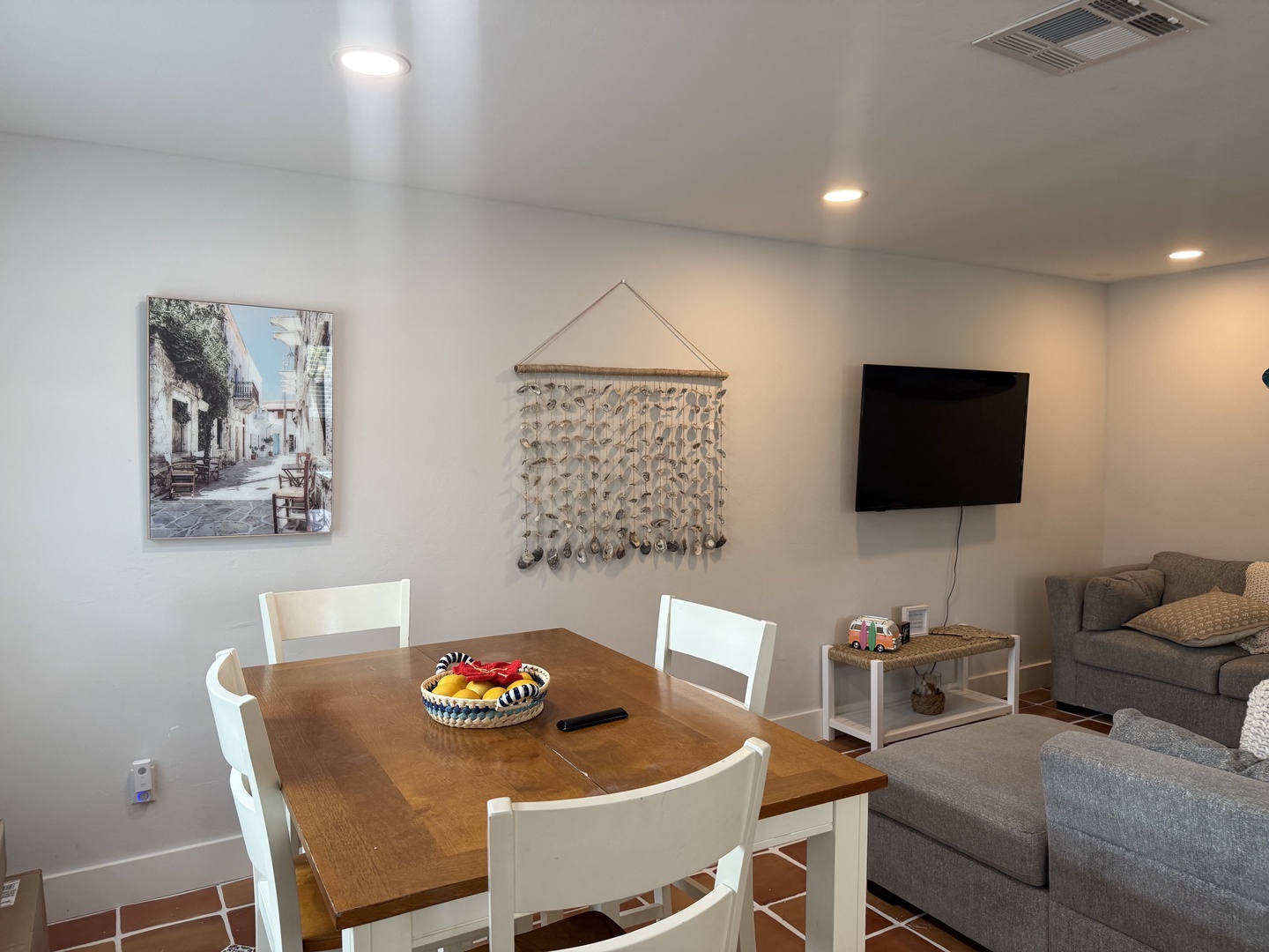 Gather around the warm wood dining table for meals and game nights, then unwind in the comfortable living room. The open layout helps you stay connected with your travel companions.