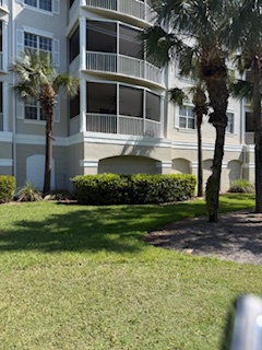 Relax on the lush, landscaped lawn and soak up the sunny Florida ambiance, perfectly framing your resort retreat with swaying palms and modern elegance.