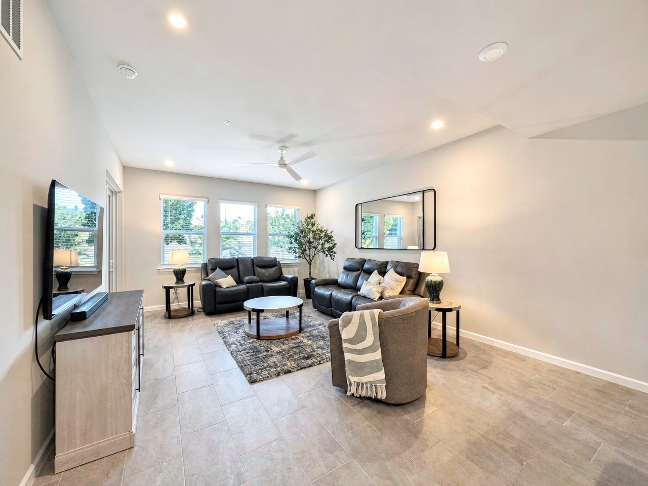 Sink into plush leather seating and unwind in your bright, open living space with room to truly spread out and relax.