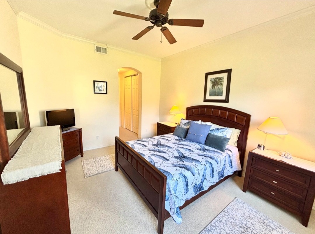 Sink into your serene bedroom retreat with comfortable furnishings, gentle lighting, and a ceiling fan for perfect temperature control.