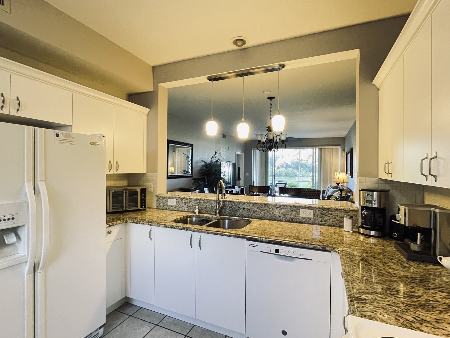 Your fully equipped kitchen features granite counters, modern appliances, and an open layout perfect for cooking together.