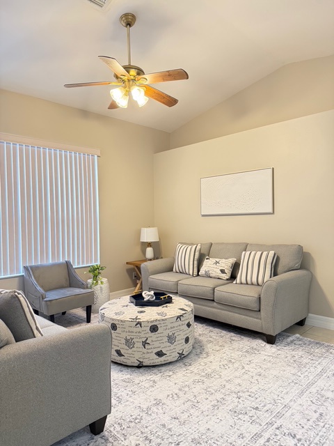 Second living area Settle into your comfortable living room where soft gray seating and warm lighting create the perfect atmosphere for relaxing after your adventures.