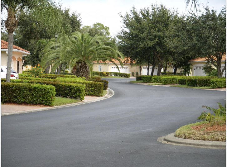 Well-maintained residential community with manicured landscaping and tree-lined streets.