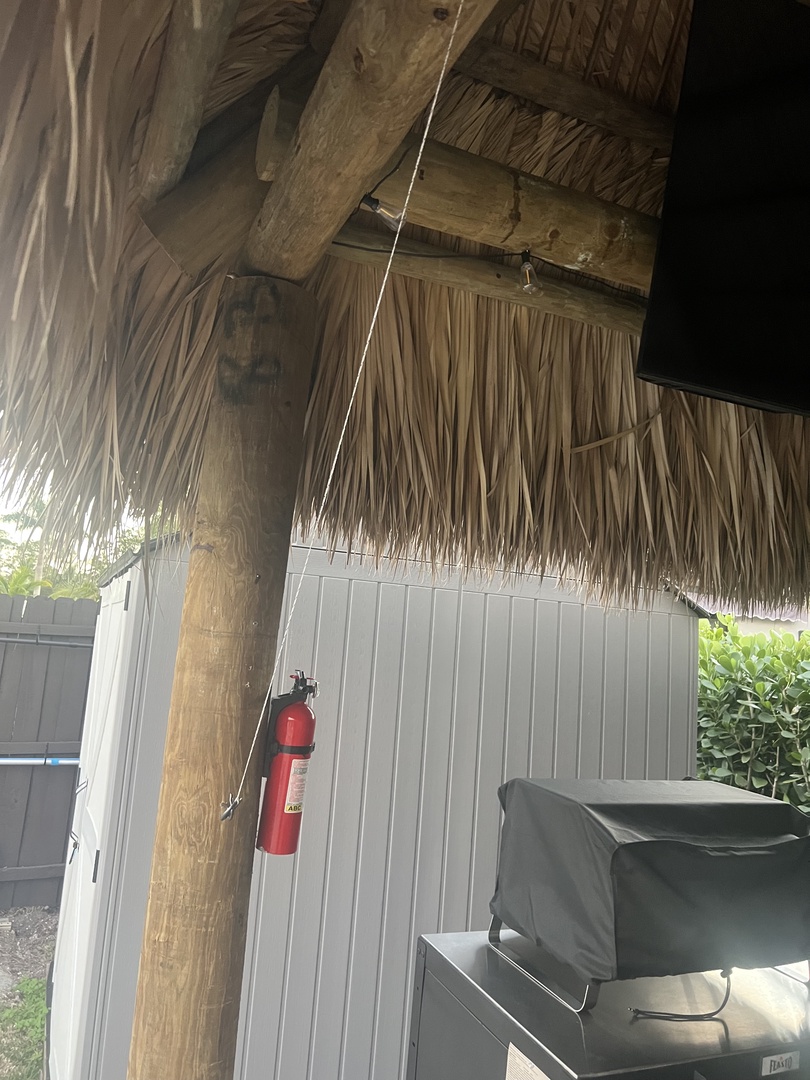 Step onto your private deck where comfortable seating awaits, surrounded by tropical thatched details and lush greenery.