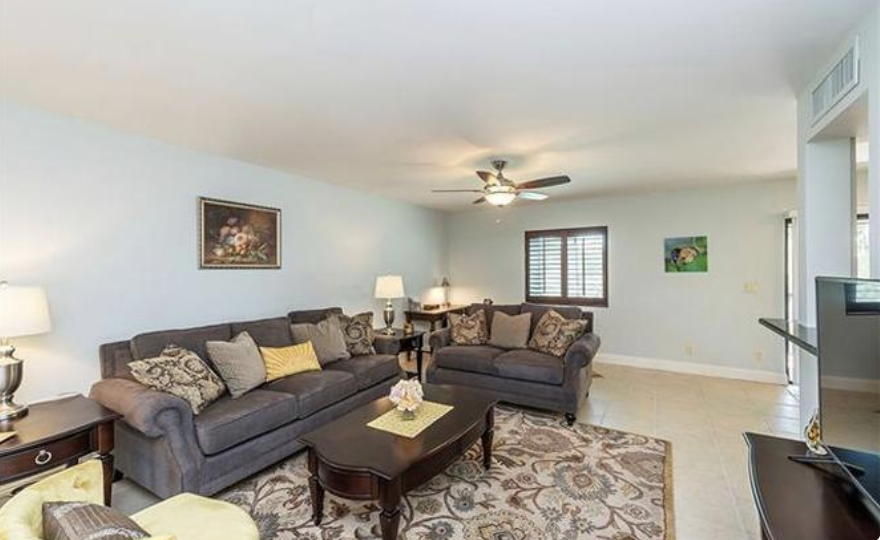Settle into plush sofas in your spacious living area, where soft lighting and classic touches create the perfect retreat after exploring.