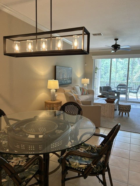 This open-concept living and dining space creates the perfect setting for your getaway. Natural light pours in through sliding glass doors leading to your private balcony, where you'll relax with peaceful forest views.