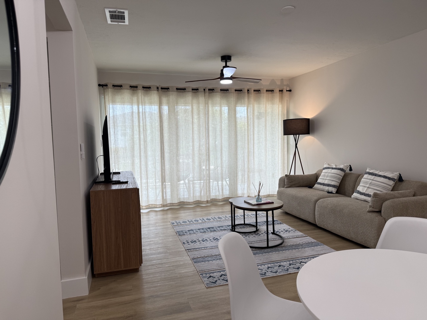 Settle into your bright, modern living space where contemporary comfort meets thoughtful design. Natural light and clean lines create your perfect retreat.