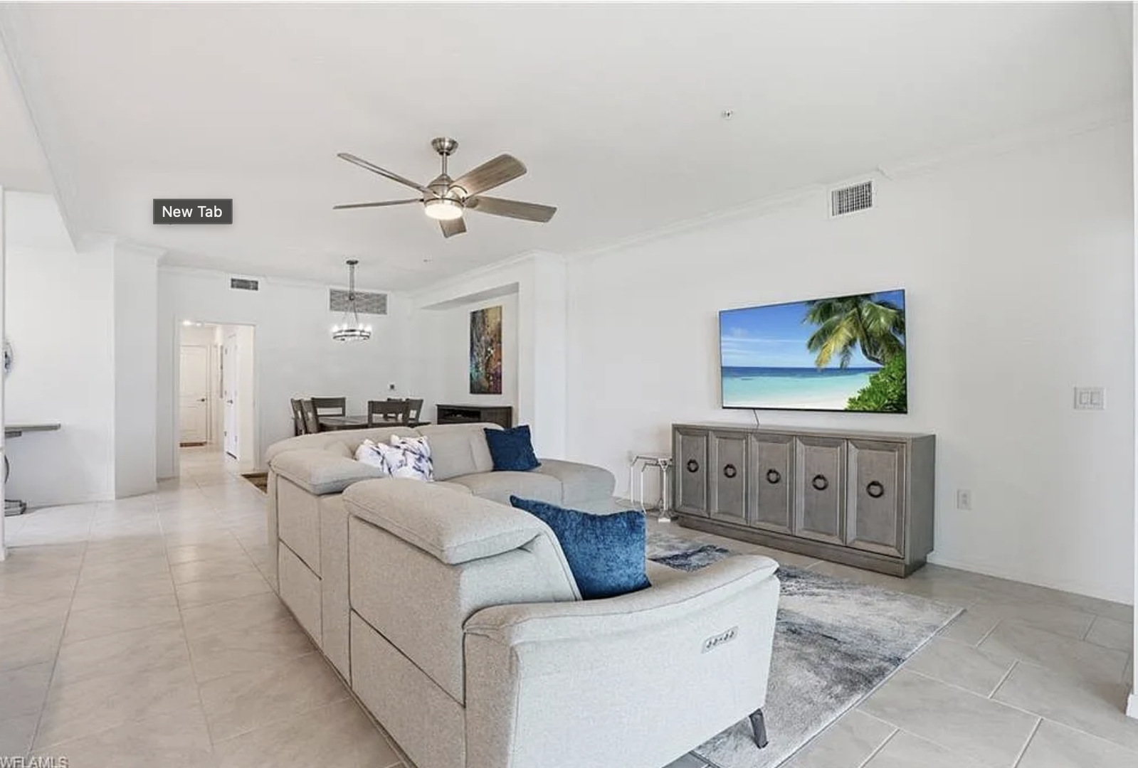 Settle into this bright, open living space where you can relax on the plush sectional after a day of adventure. High ceilings and natural light create an airy atmosphere perfect for unwinding with your favorite shows or planning your next outing.