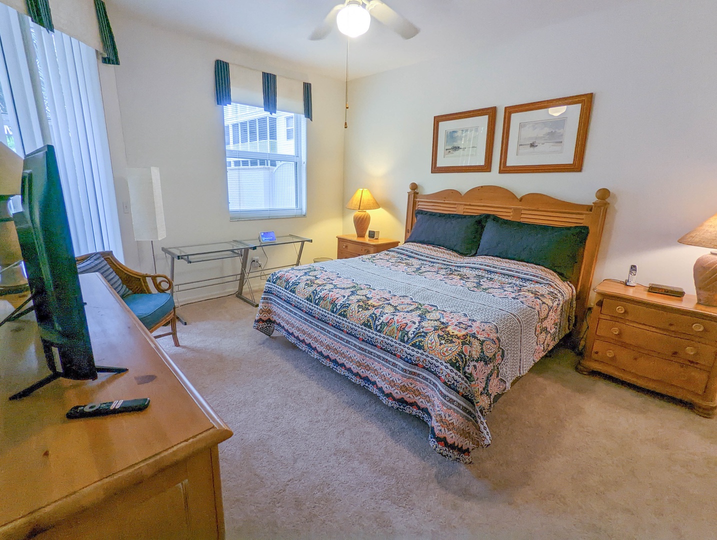 Unwind in your peaceful bedroom featuring warm wood furniture, soft natural light, and thoughtful coastal touches that create the perfect retreat.