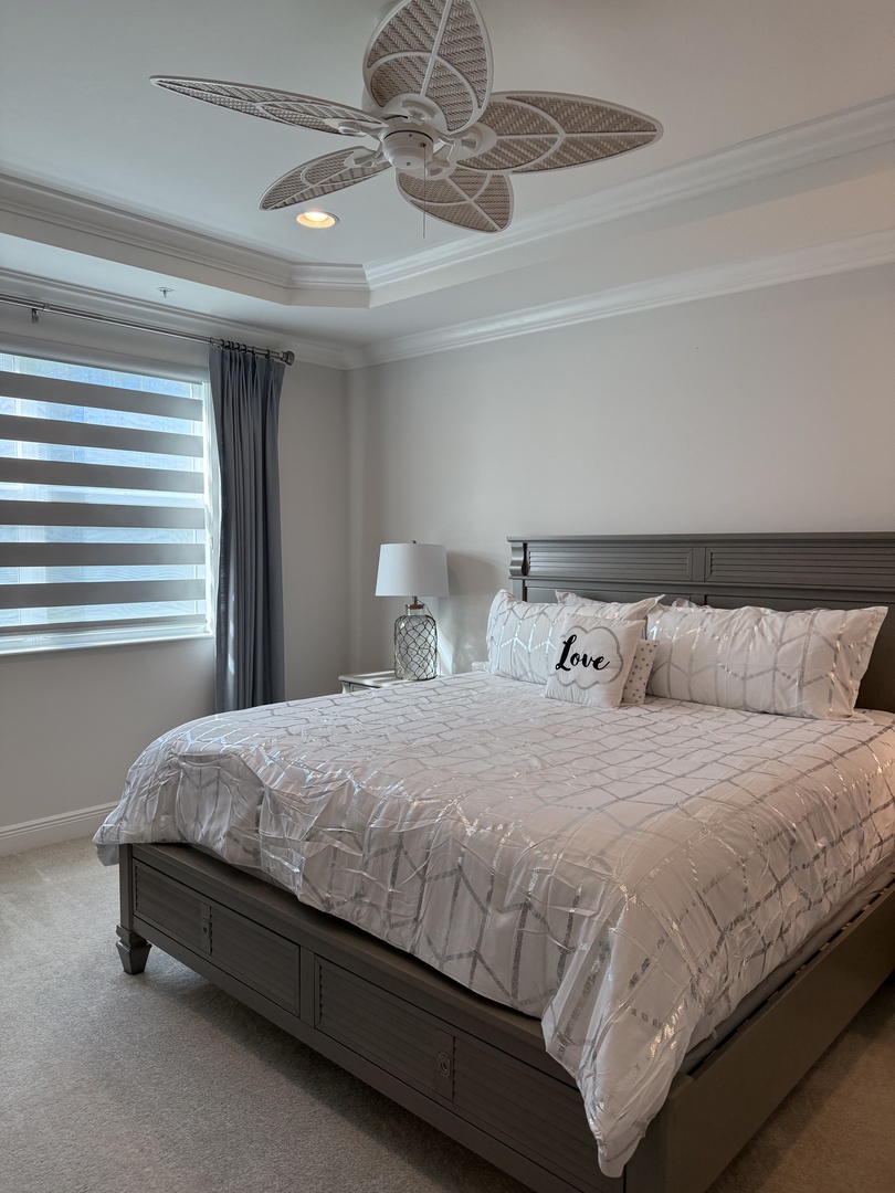 Sink into your cozy retreat with plush linens and gentle ceiling fan breezes keeping you comfortable all night long.