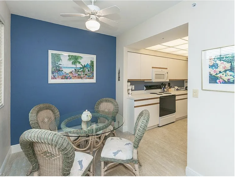 Settle in at your cozy dining nook with wicker chairs and a glass table, perfect for morning coffee or casual meals. The open layout flows right into your kitchen, making everything effortlessly convenient.